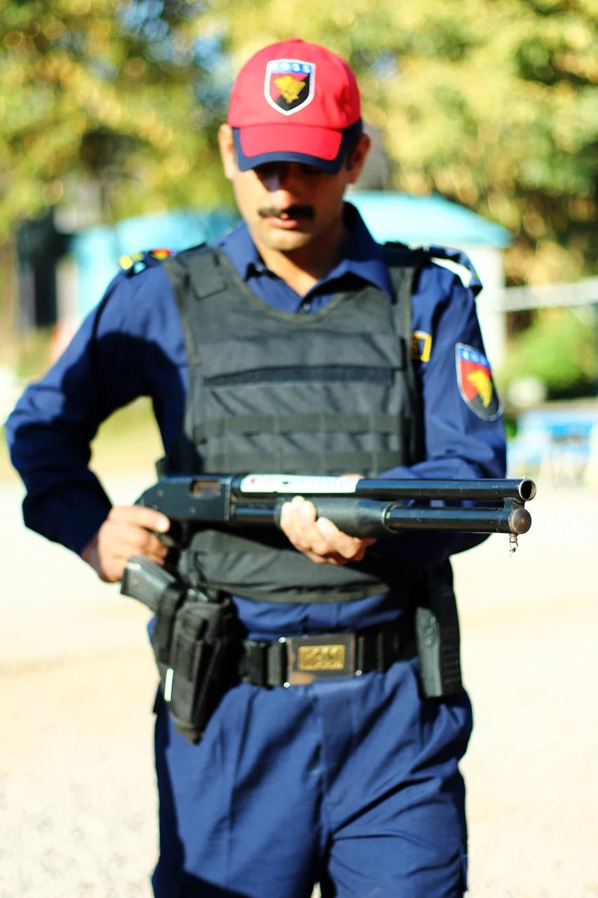 Ready Guard officer armed with a shotgun on duty